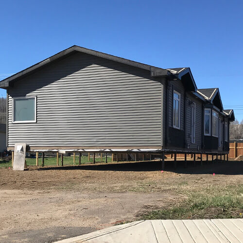 Manufactured home in Edmonton sitting on pile foundation