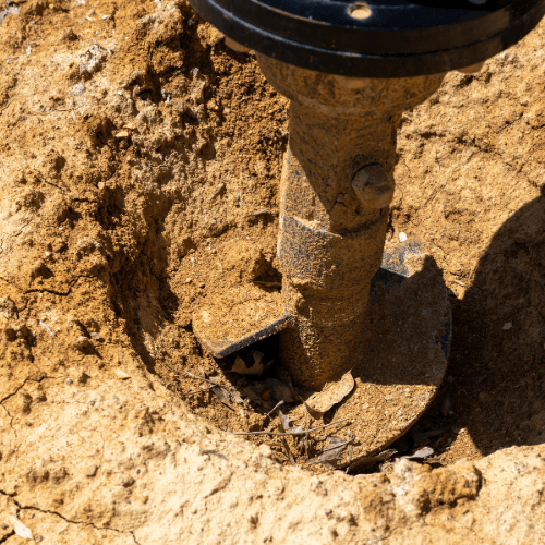 Auger head on a skid steer