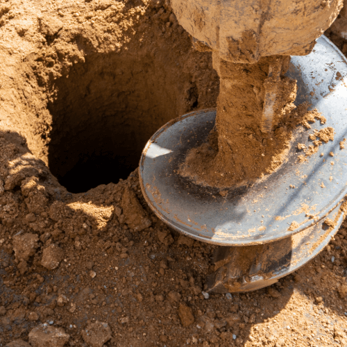 Hole drilled with a skid steer mounted earth auger