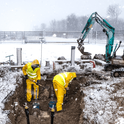 Crew excavates during winter season